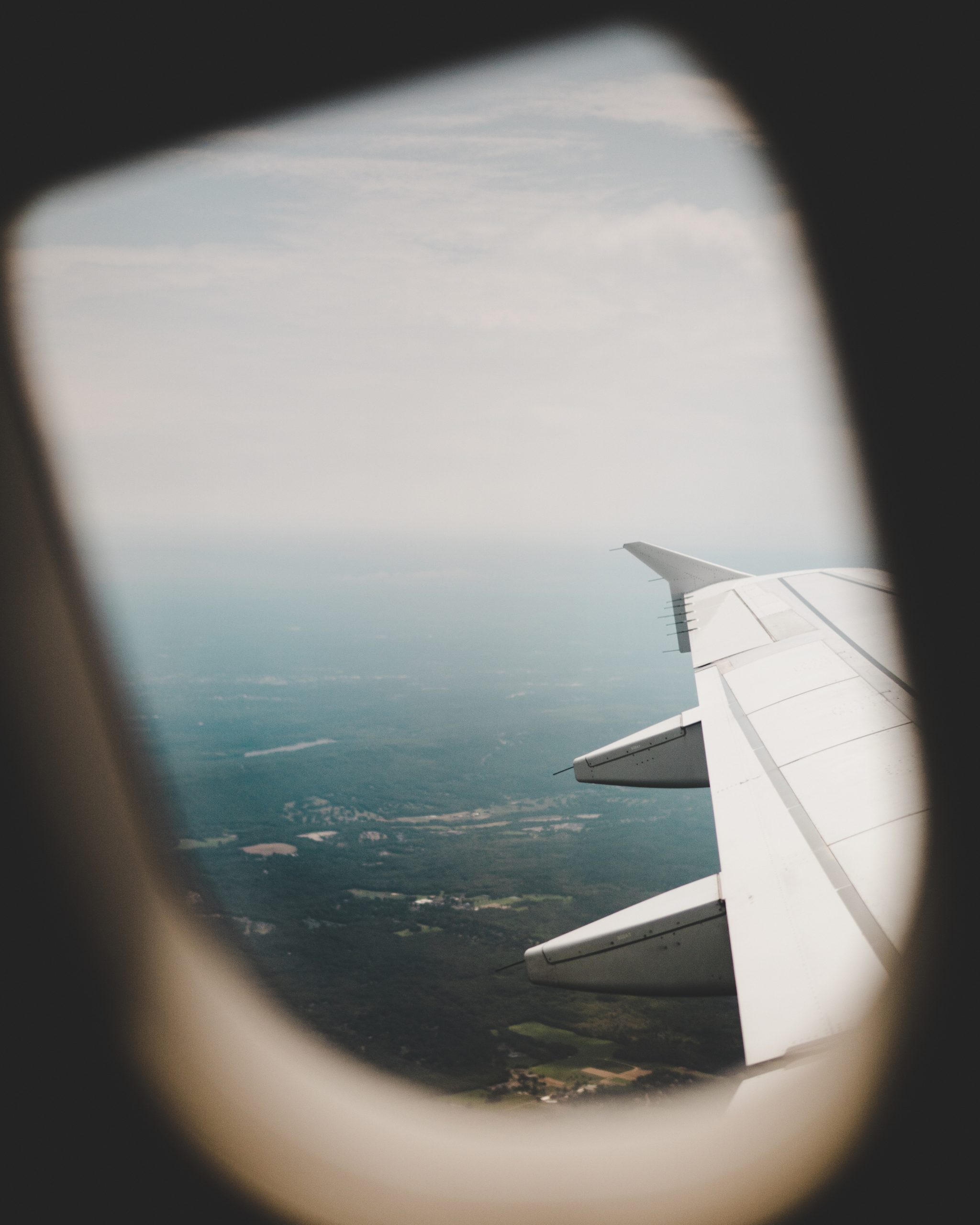 View of an aircraft wing through the cabin window